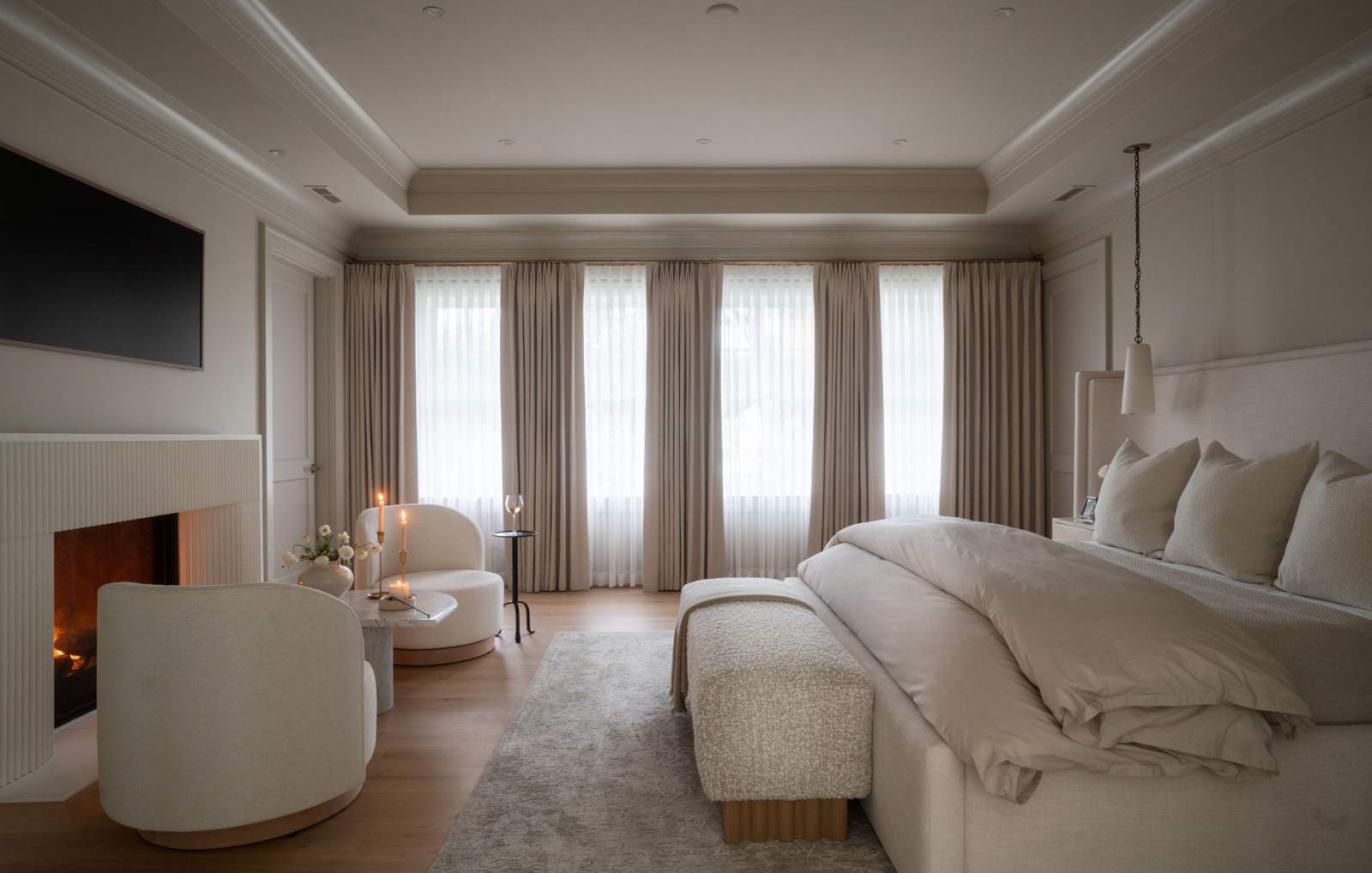 the sophisticated interior of a neutral color palette in the bedroom of a contemporary home