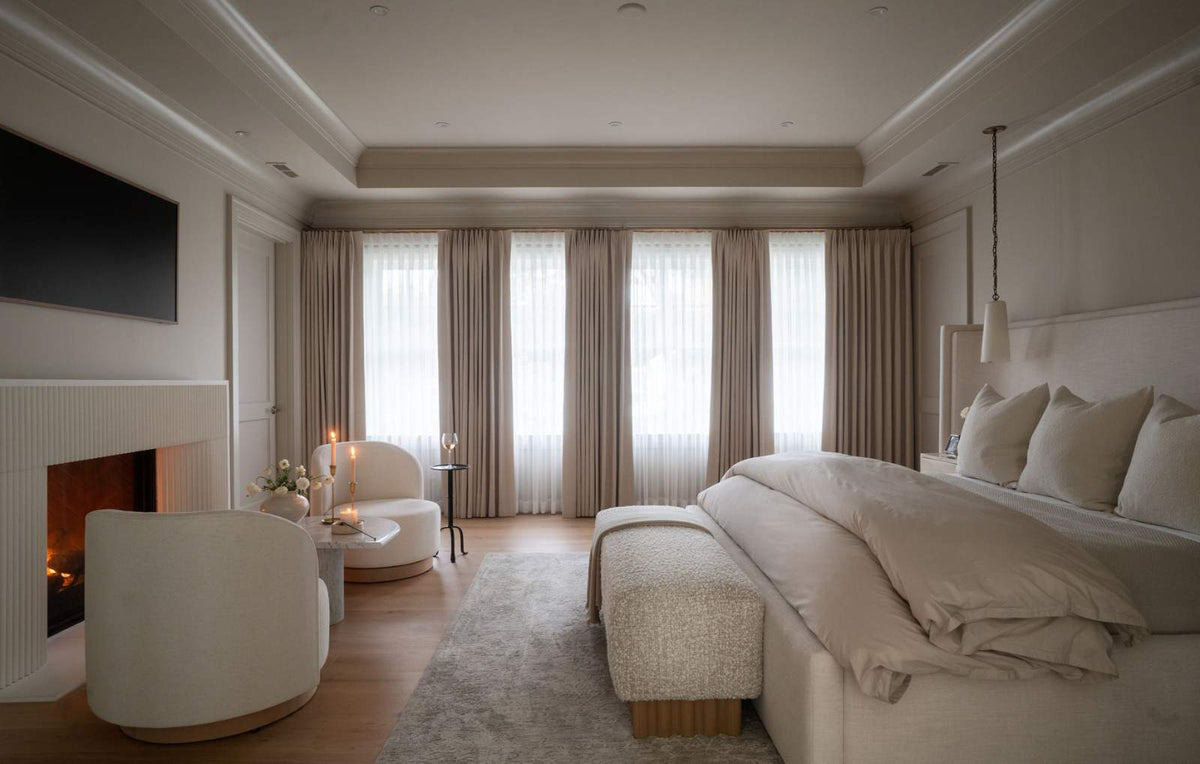 the sophisticated interior of a neutral color palette in the bedroom of a contemporary home