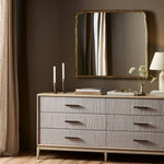 Loire Mantle Mirror above a dresser with decor on it in a room with brown walls and curtains on the side