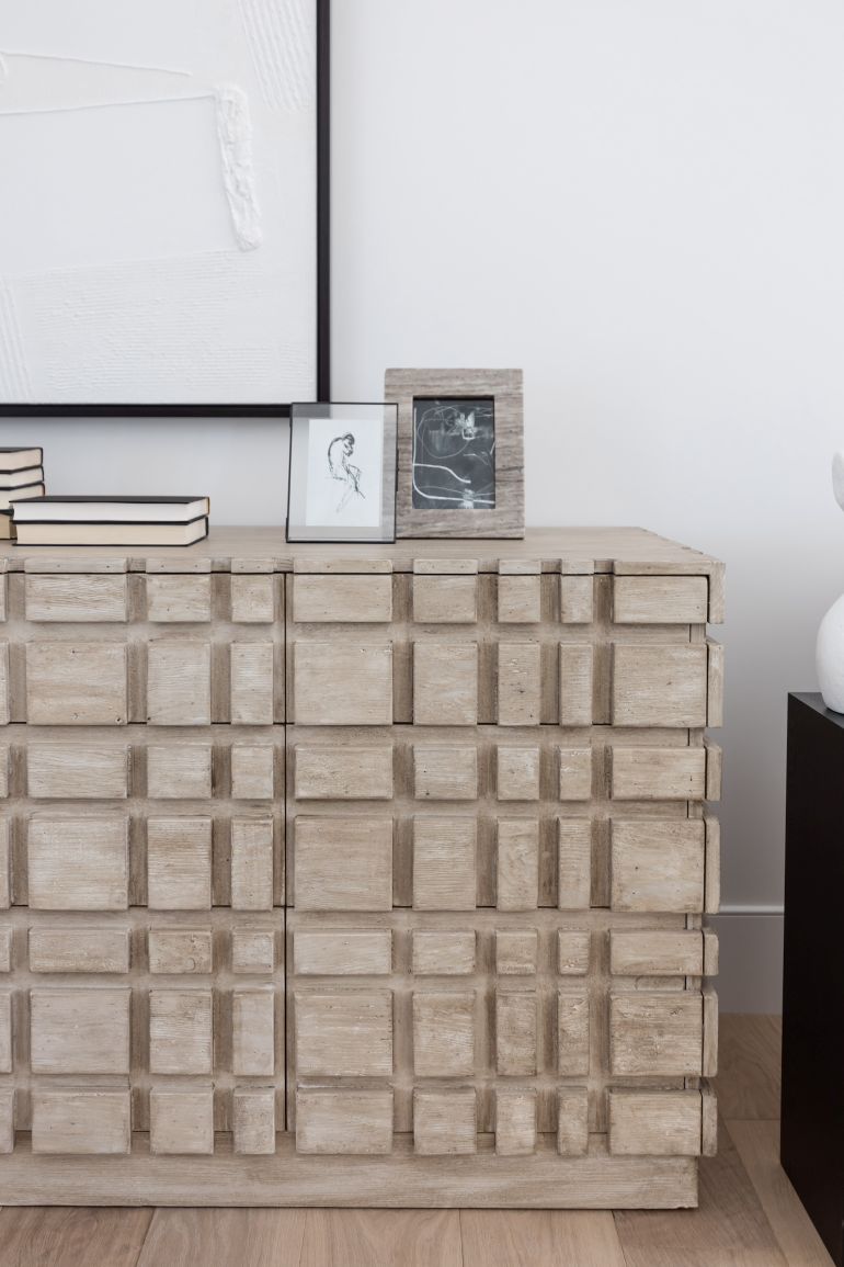 The Oslo statement dresser with books and photos on top
