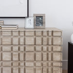 The Oslo statement dresser with books and photos on top