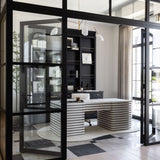 Modern home office workspace with glass walls and a unique wooden white desk.