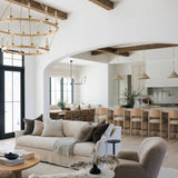 Modern living room with neutral tones and wooden beams with the Kadon Swivel chair