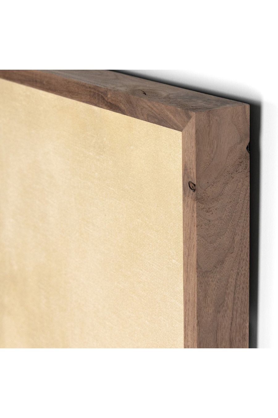 Close-up of a wooden frame corner of landscape wall art piece with a white background